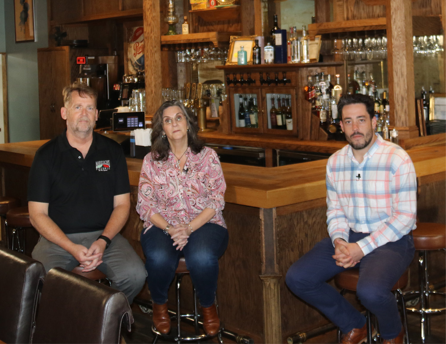 John Rippeberger (left) and Maryangela Ripperberger (center), owners of Marioochi’s Pizzeria, on Liberty Square in Sparta, will be featured in the upcoming segment of “Wish You Were Here!”