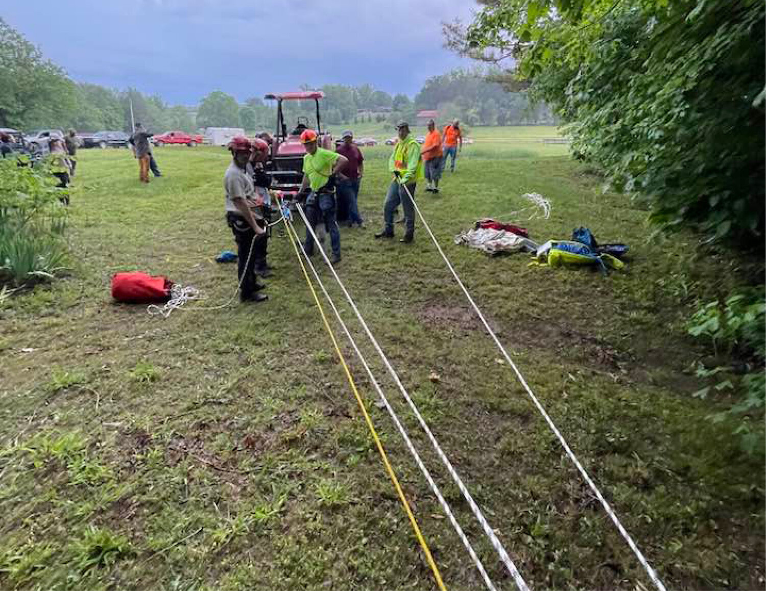 Sparta-White County Rescue Squad arrived on the scene and set up a rope system to lower a member of the team over the bluff, with a small animal harness to assist in retrieval of a dog.
