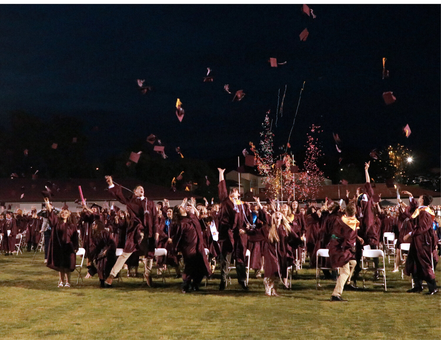 Members of the White County High School Class of 2023 throw their hats in the air as part of the tradition that signifies the end of the ceremony. (Photo by CHRIS BRIGHT)